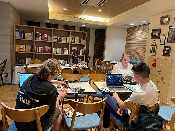 Three students studying together at table