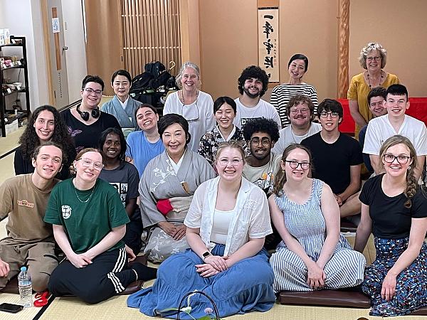 Student group posing for photo inside tea room