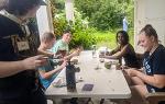 Group shot of students at outdoor table 